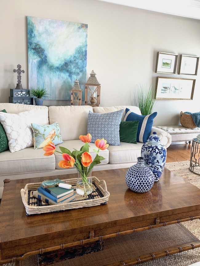 See how Kim at Perfecting Places uses vibrant coral., blue, and green to decorate for spring.