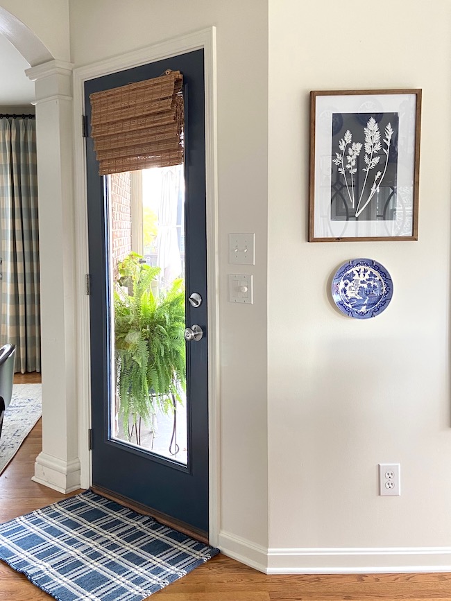 Navy Kitchen Door in BM Hale Navy and walls are painted Alabaster.