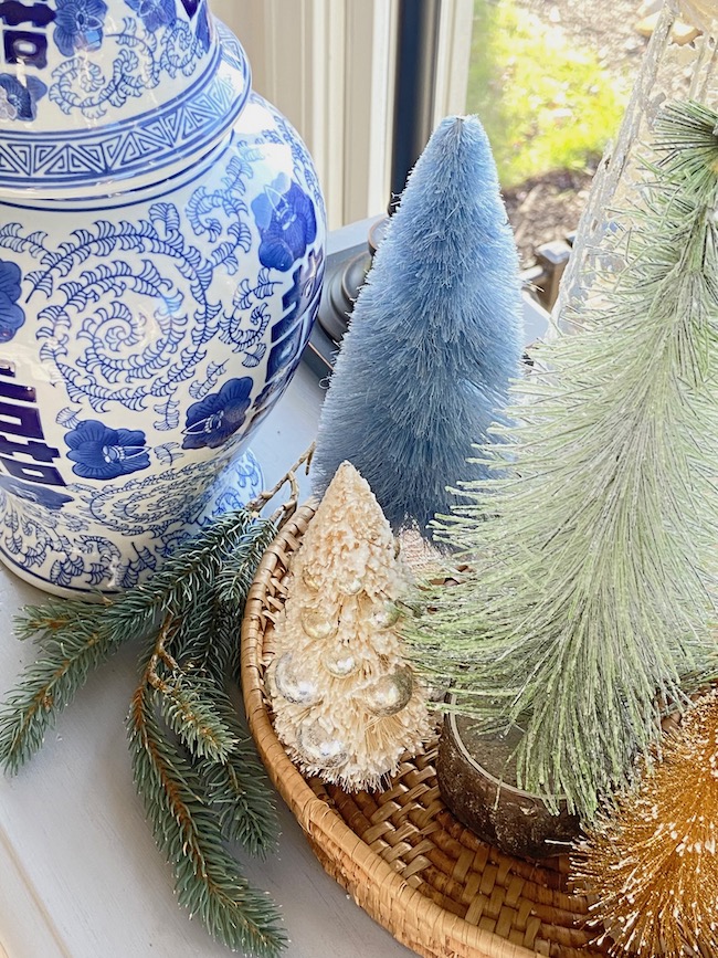 https://perfectingplaces.com/wp-content/uploads/2021/11/decorate_with_bottle_brush_trees_Chinoiserie_tray.jpeg