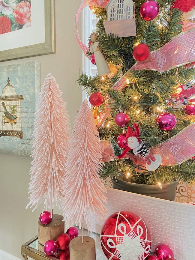 https://perfectingplaces.com/wp-content/uploads/2021/11/decorate_with_pink_bottle_brush_trees_pink_and_red.jpeg