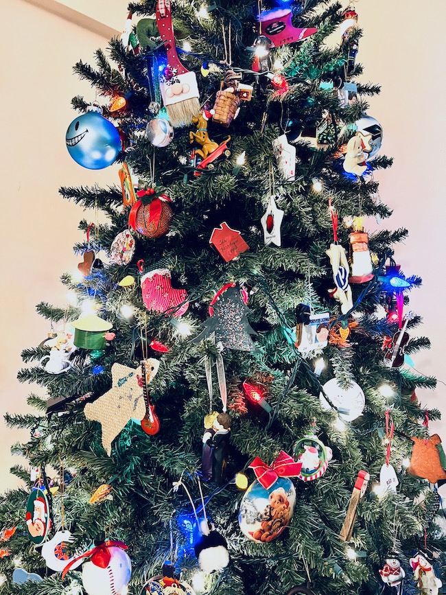 Christmas Tree with Family Ornaments and Colorful Lights