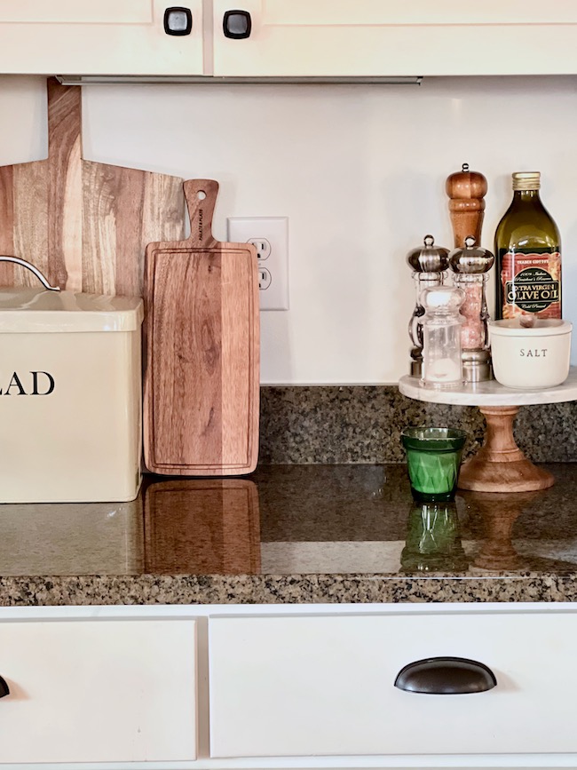 Wooden Cutting Boards and Pedestal Stand in Kitchen