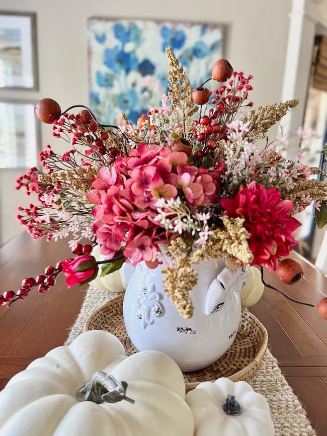 Fall centerpiece with crandberry and rose flowers