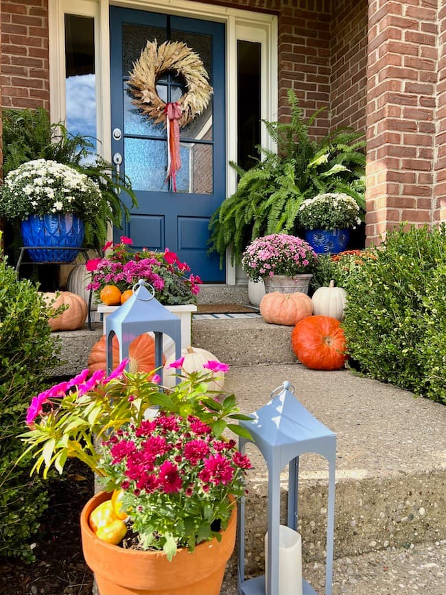 Blue Front Door with colorful front porch decor for fall