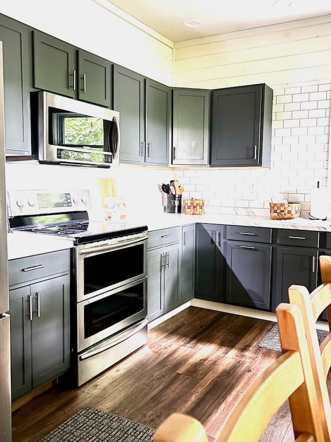 These lake house kitchen cabinets are painted SW Peppercorn.