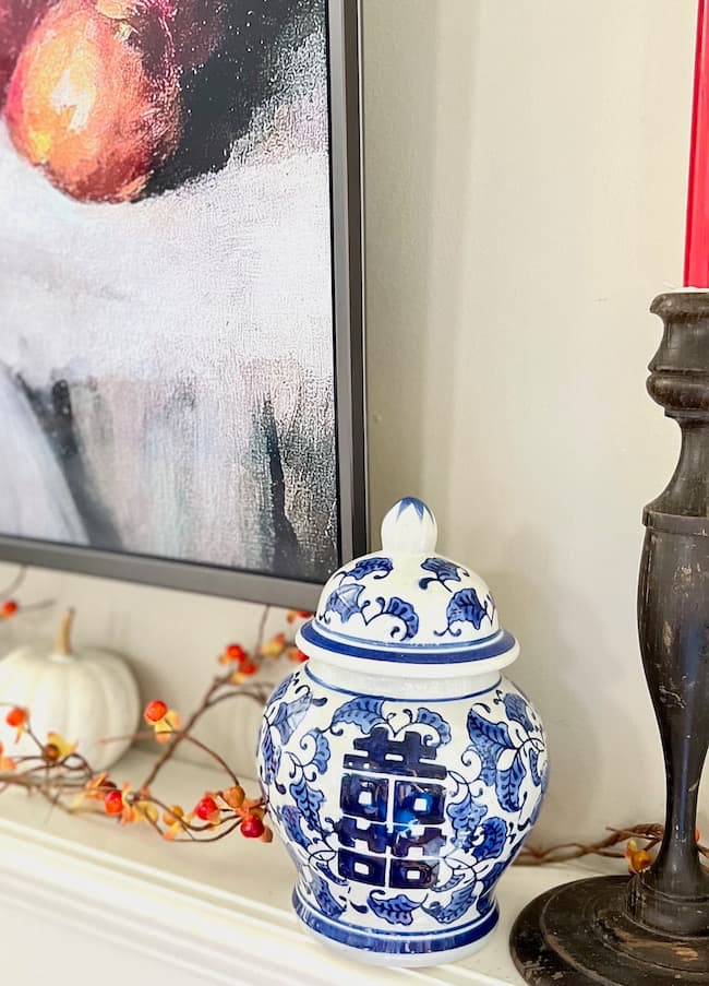 Blue and White Ginger Jar and Orange Bittersweet on fireplace mantel for fall