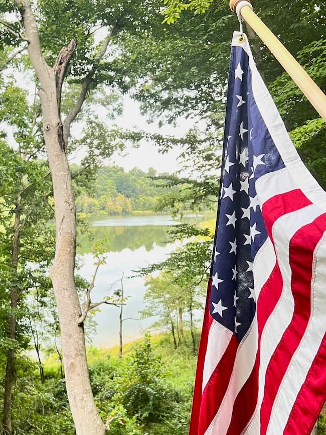 Lake House View with American Flag
