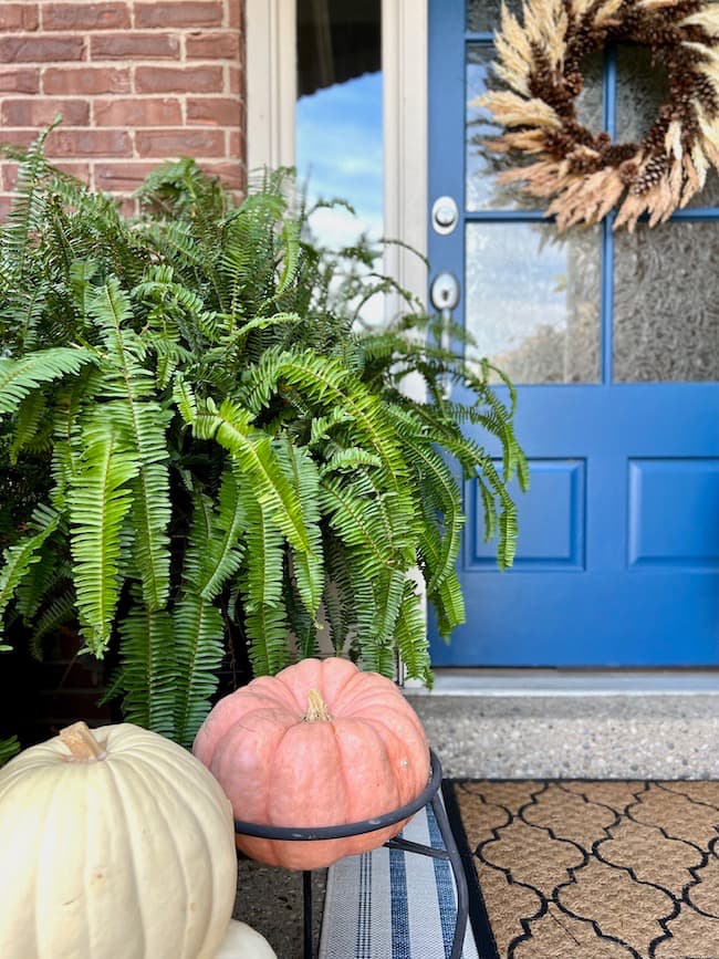 Fall porch with DIY pinecone wreath