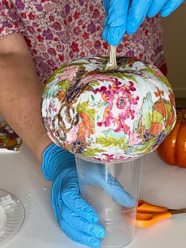 Let the decoupage pumpkin dry