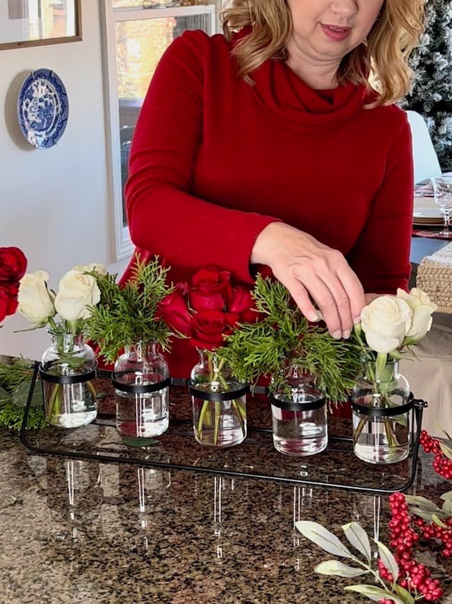 DIY Christmas Centerpiece with red and white roses in bud vase holder