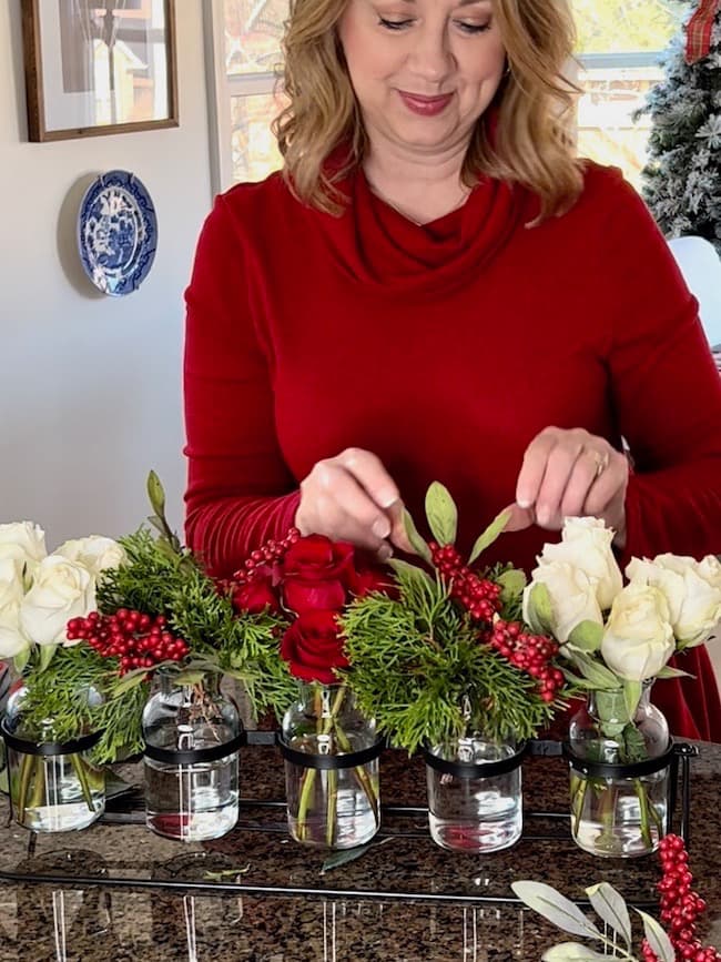 DIY Christmas Centerpiece with red and white roses in bud vase holder