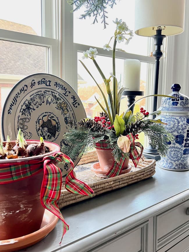 Kitchen buffet with forced paperwhites and faux paperwhite arrangement for Christmas