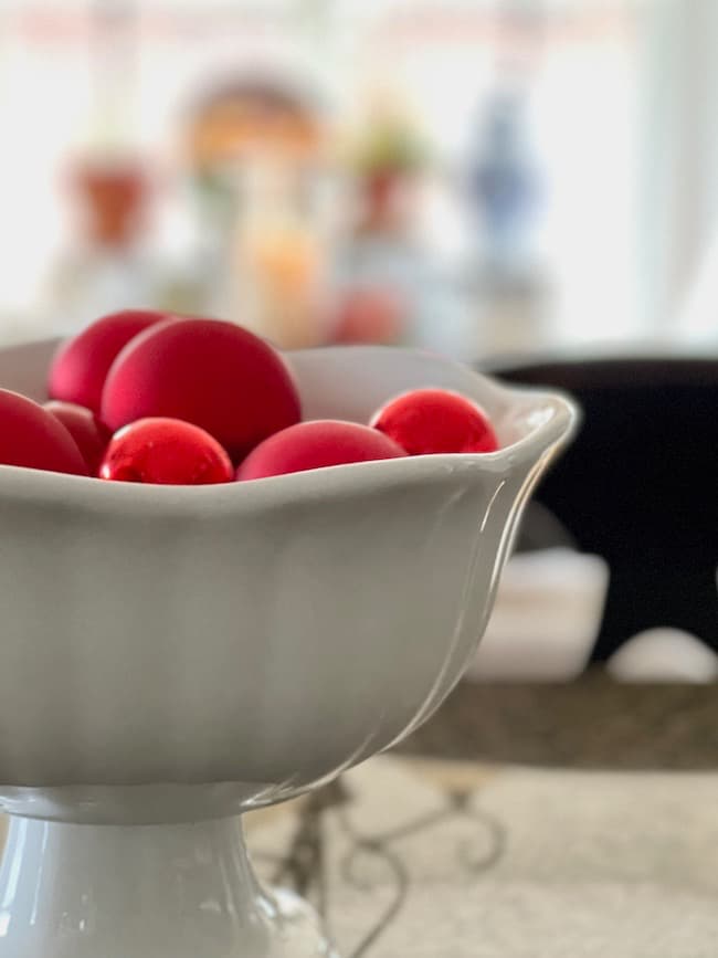 Bowl of Red Christmas balls in kitchen