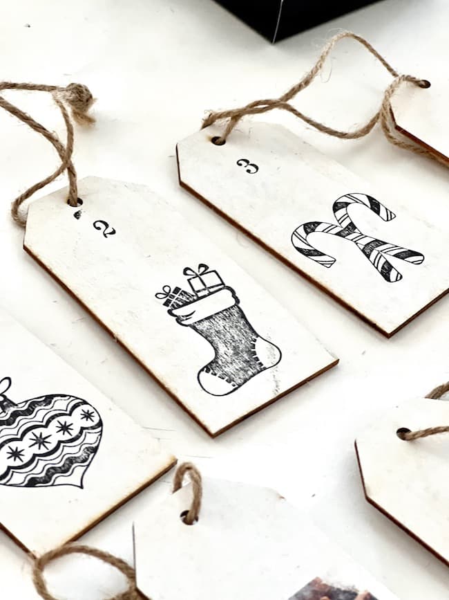 Stamp wooden tags to create DIY advent calendar