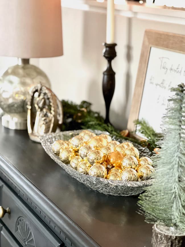 Vintage Gold Christmas balls on the buffet