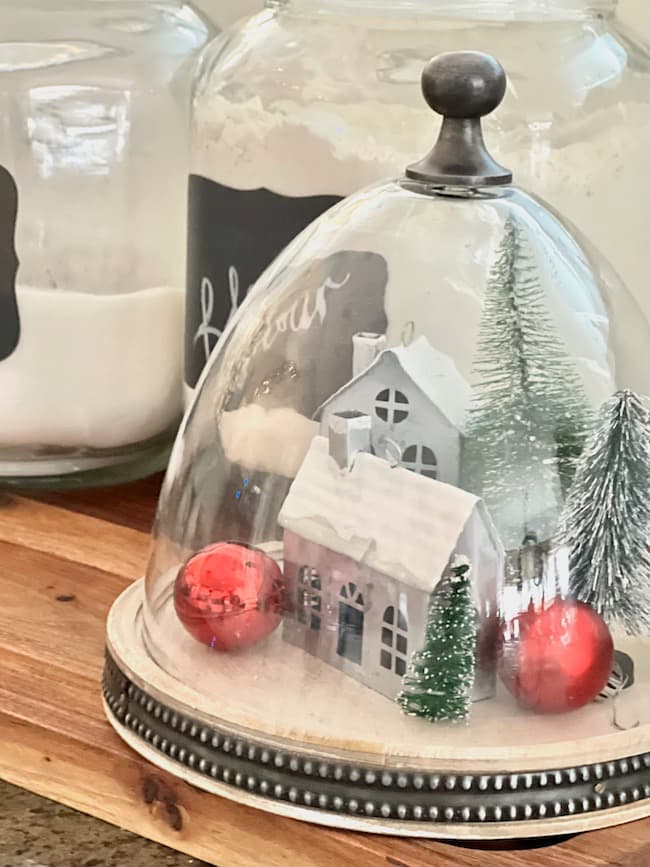 Kitchen Christmas Ideas -- Glass Cloche with Houses and Bottle Brush Trees