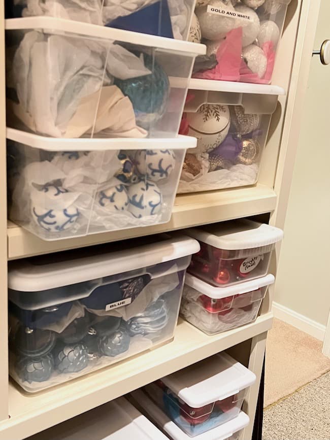 Christmas storage bins organized in basement