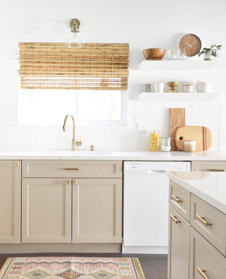 These kitchen cabinets are painted Sherwin Williams Accessible Beige. Photo by Centsational Style