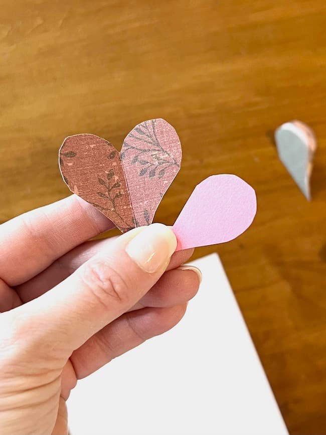 Make a heart template with paper.