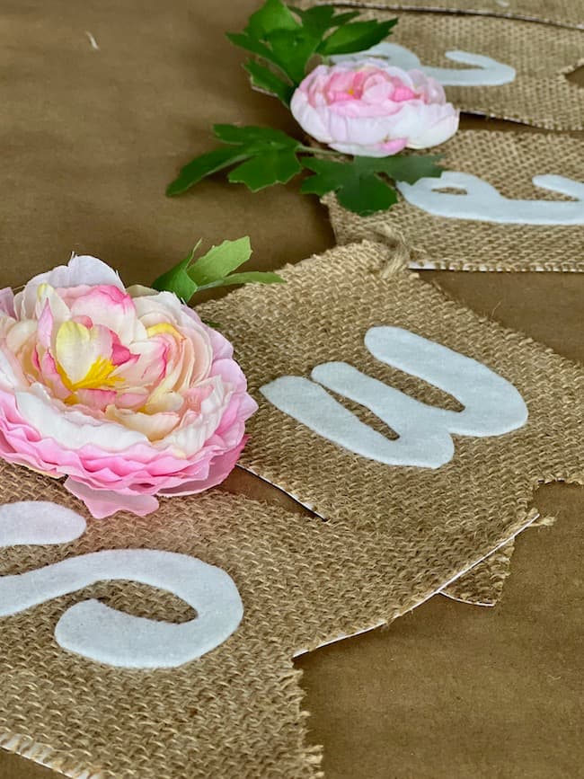 Baby shower banner made with burlap, felt, and faux flowers