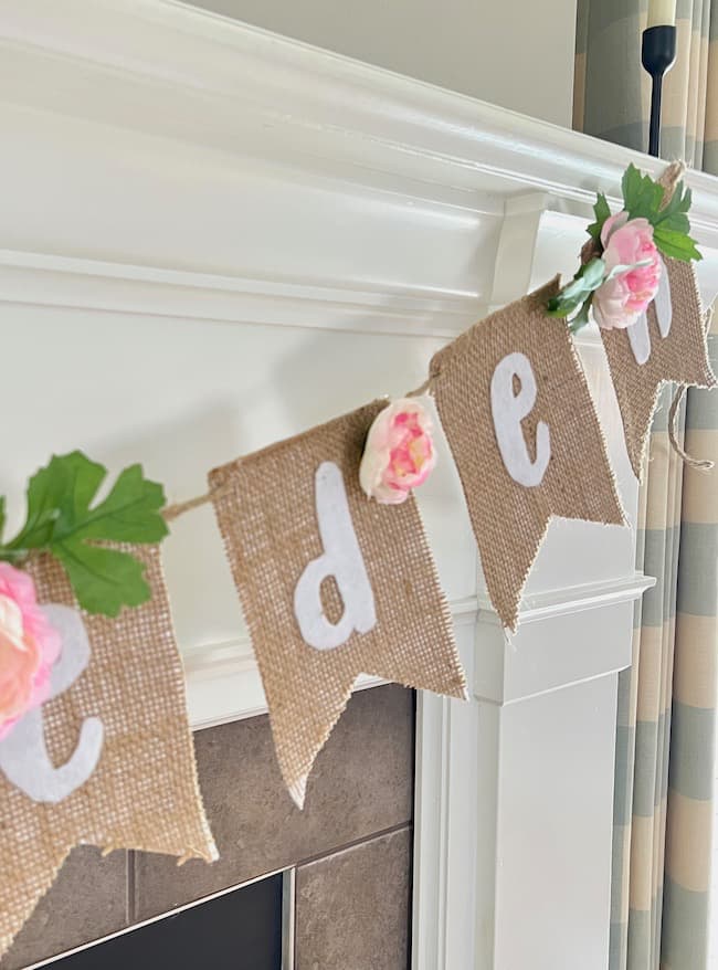Baby shower banner made with burlap, felt, and faux flowers