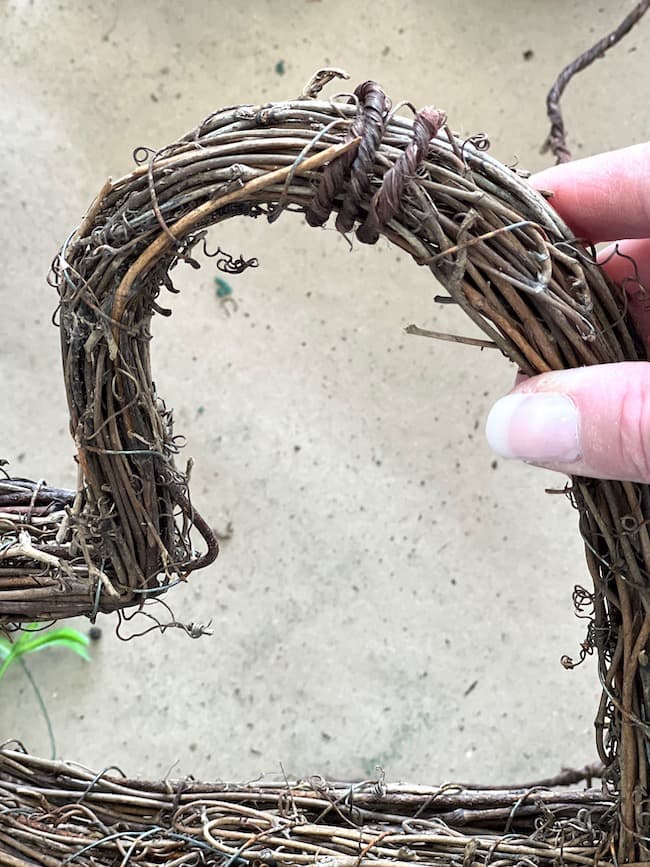 Tie two small grapevine hearts together with grapevine wire.