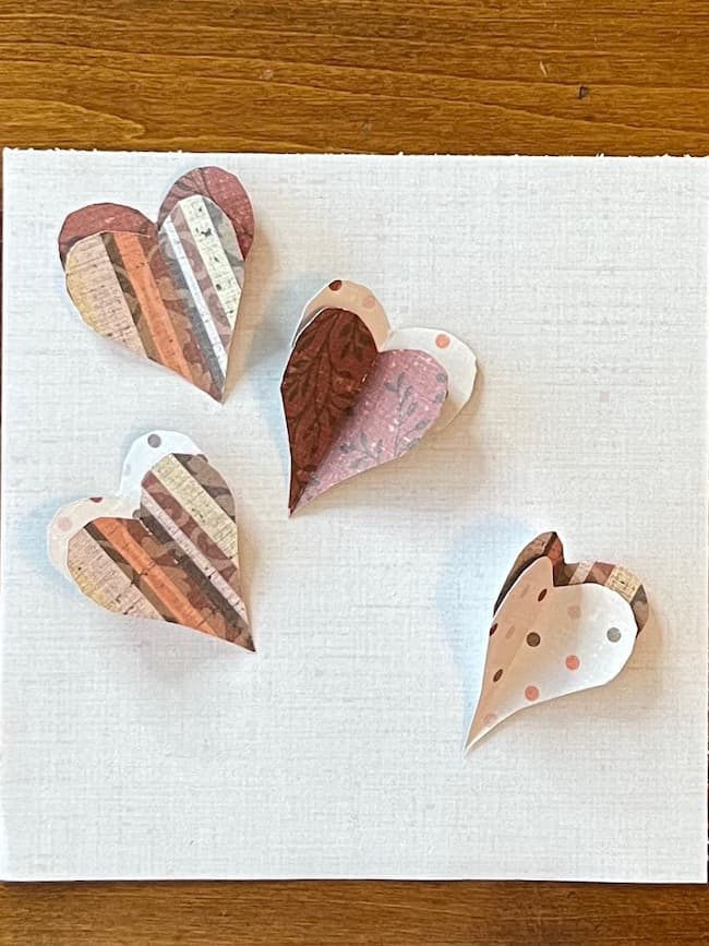 Create layers of hearts with scrapbook paper.