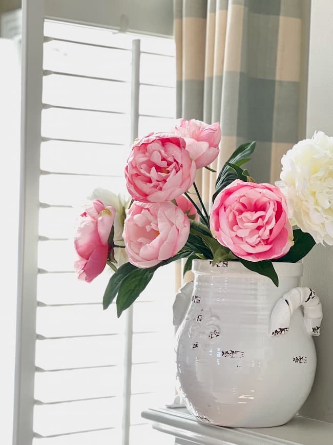 Pink and White Faux peonies on the mantel