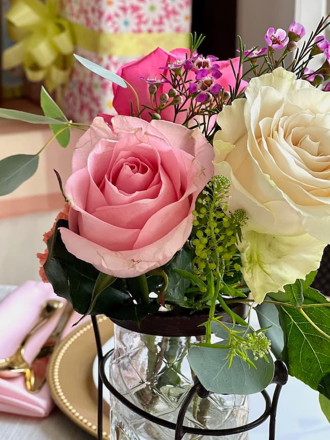 Baby shower flower centerpiece with pink and white roses