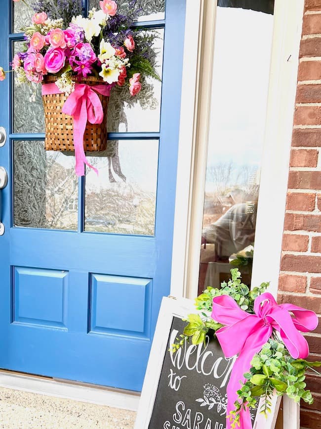 Front porch decor with flower bucket hanger and chalkboard sign for baby shower