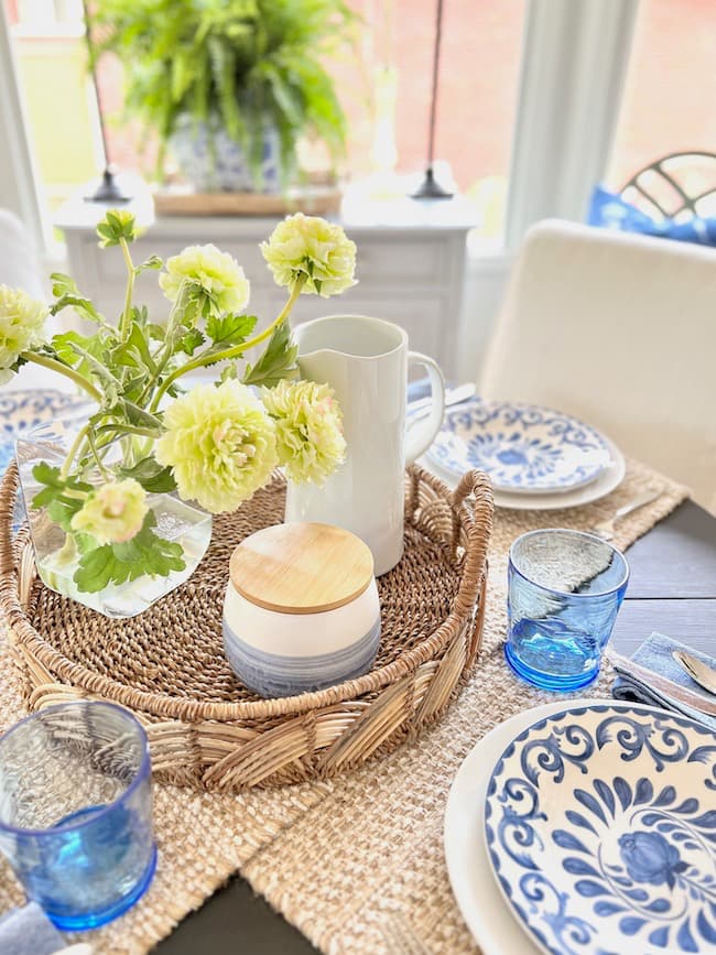 Ideas for Spring Flower Arrangements - faux green ranunculus arrangement in rattan tray