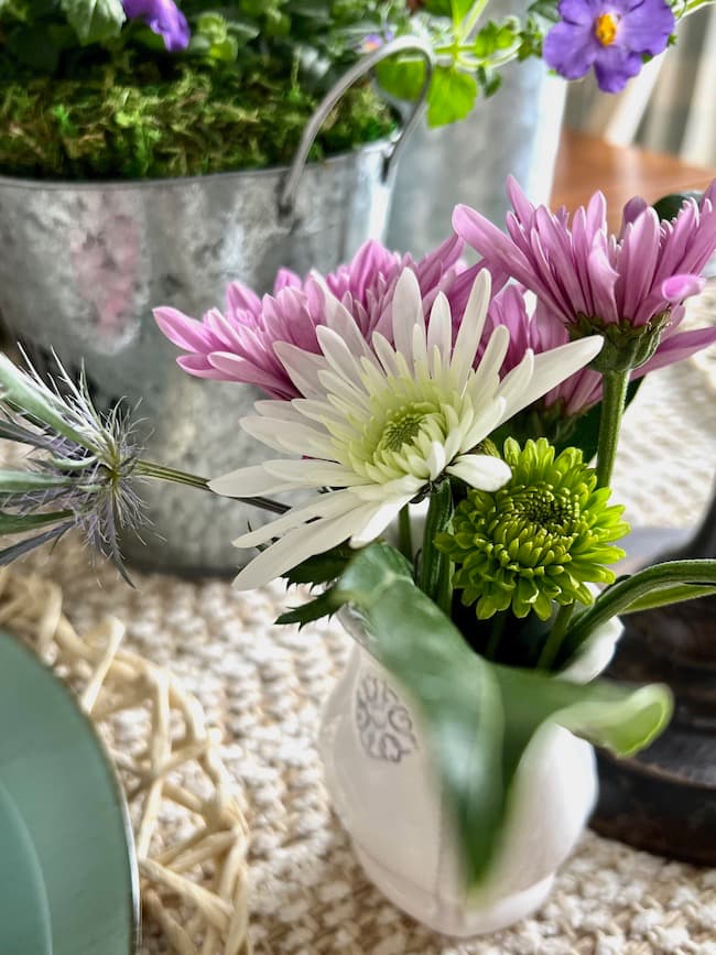 Petite floral arrangement in small bud vase