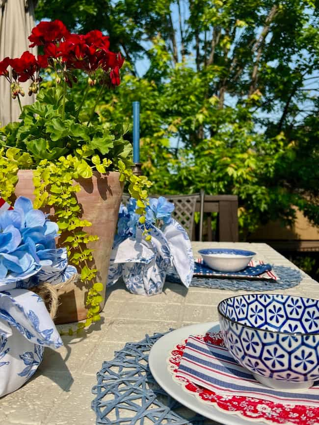 Patriotic centerpiece ideas with napkin-wrapped Mason jars