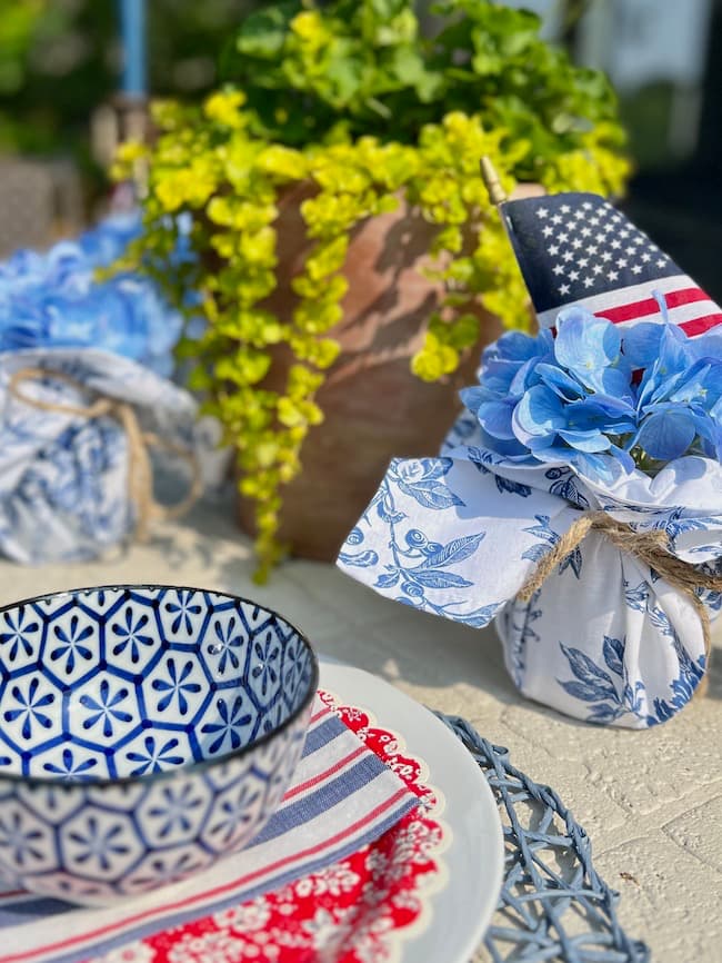 Patriotic centerpiece ideas with napkin-wrapped Mason jars