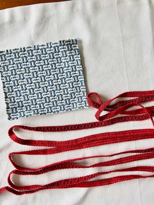 Make a flag pillow with fabric scraps and drapery trim.