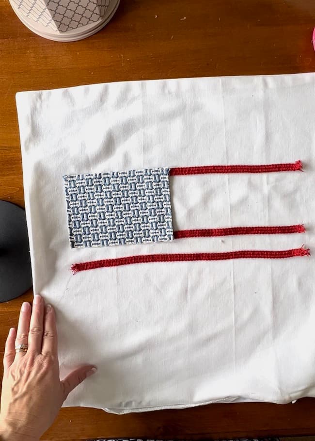 Plan out and space the trim to make the flag's stripes.