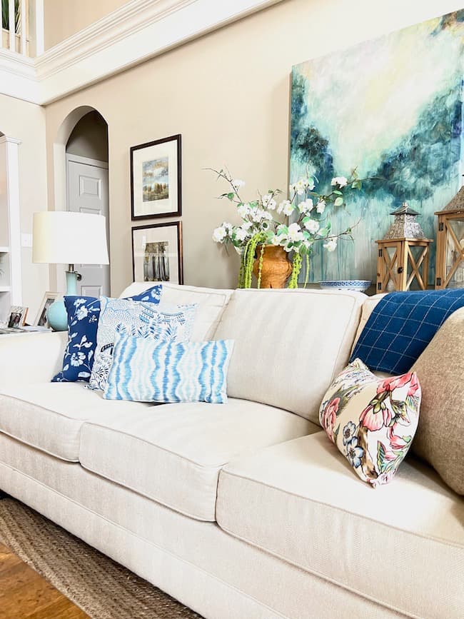Living room sofa with coastal artwork