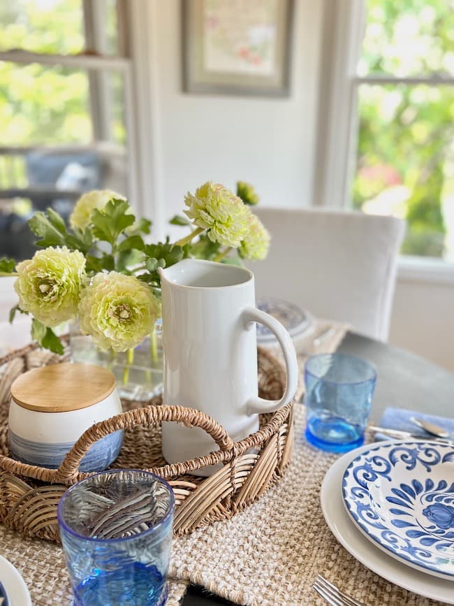 Simple summer centerpiece for round table with rattan basket tray