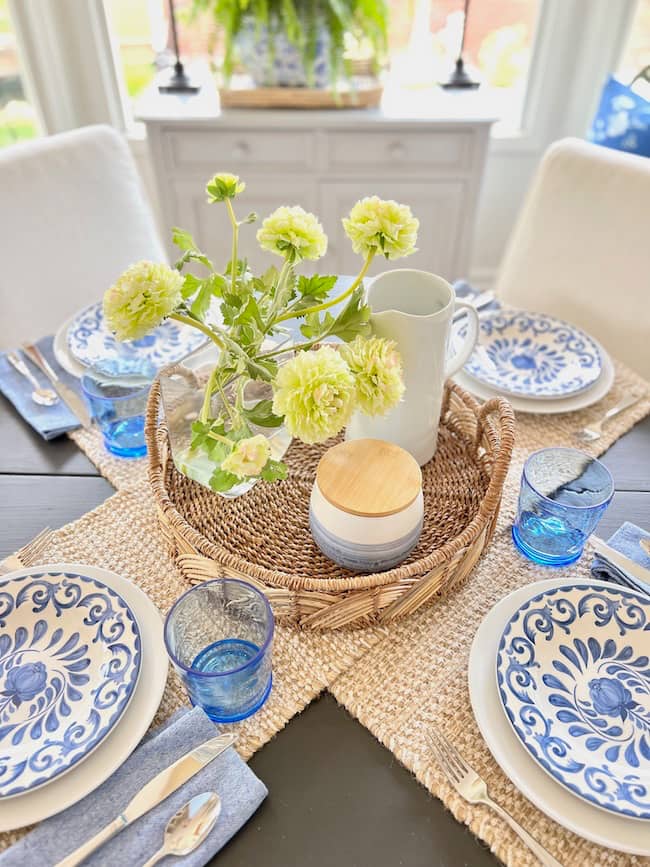 Blue and white summer table settings and rattan centerpiece