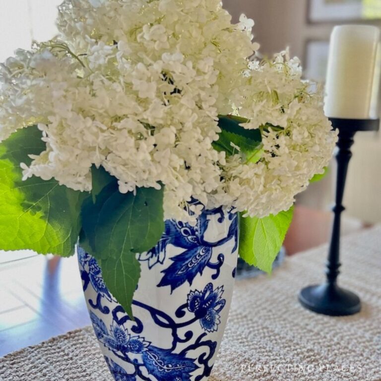 White hydrangeas in blue and white ginger jar vase