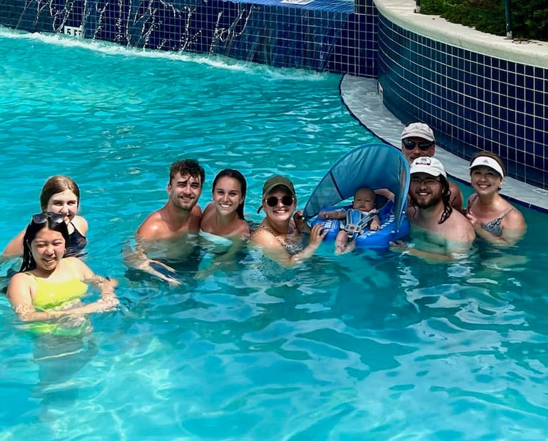 Vacation photo of family in the pool