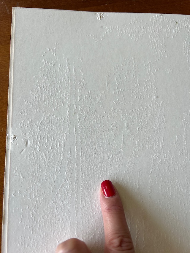 The textured background created when pulling away the paper backing.
