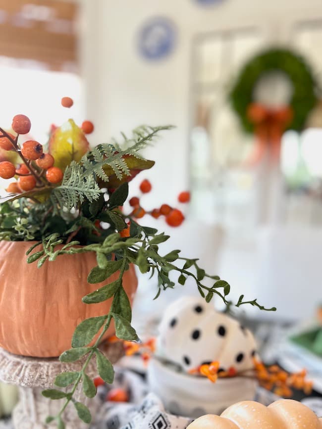 Fall arrangement in pumpkin vase