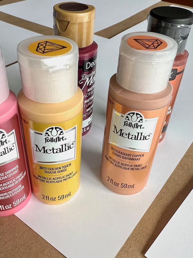 Metallic paint for painting leaves in the garland shades of pink, rust, gold, and terracotta