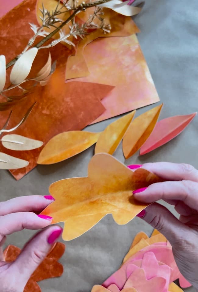 Crease the leaves to add dimension to them before adding to the garland.