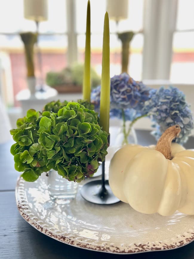 Fall Kitchen Decor Simple Table Centerpiece with dried hydrangea, green candles, and faux white pumpkins