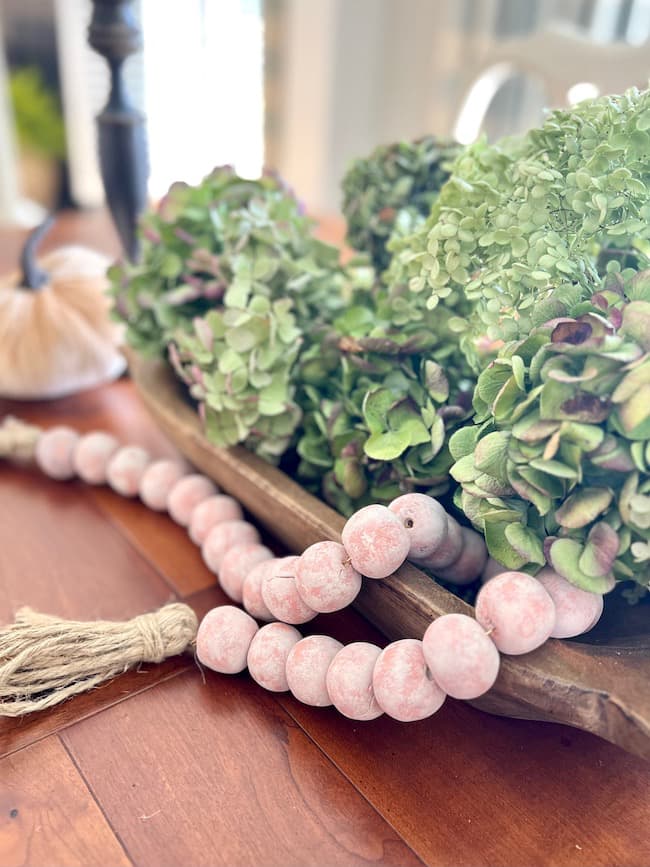 Beaded garland in dough bowl with hydrangeas