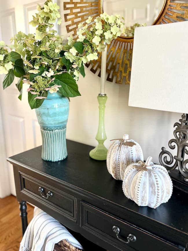 Foyer Table Decor for Fall -- pumpkins, fall centerpiece, and candle