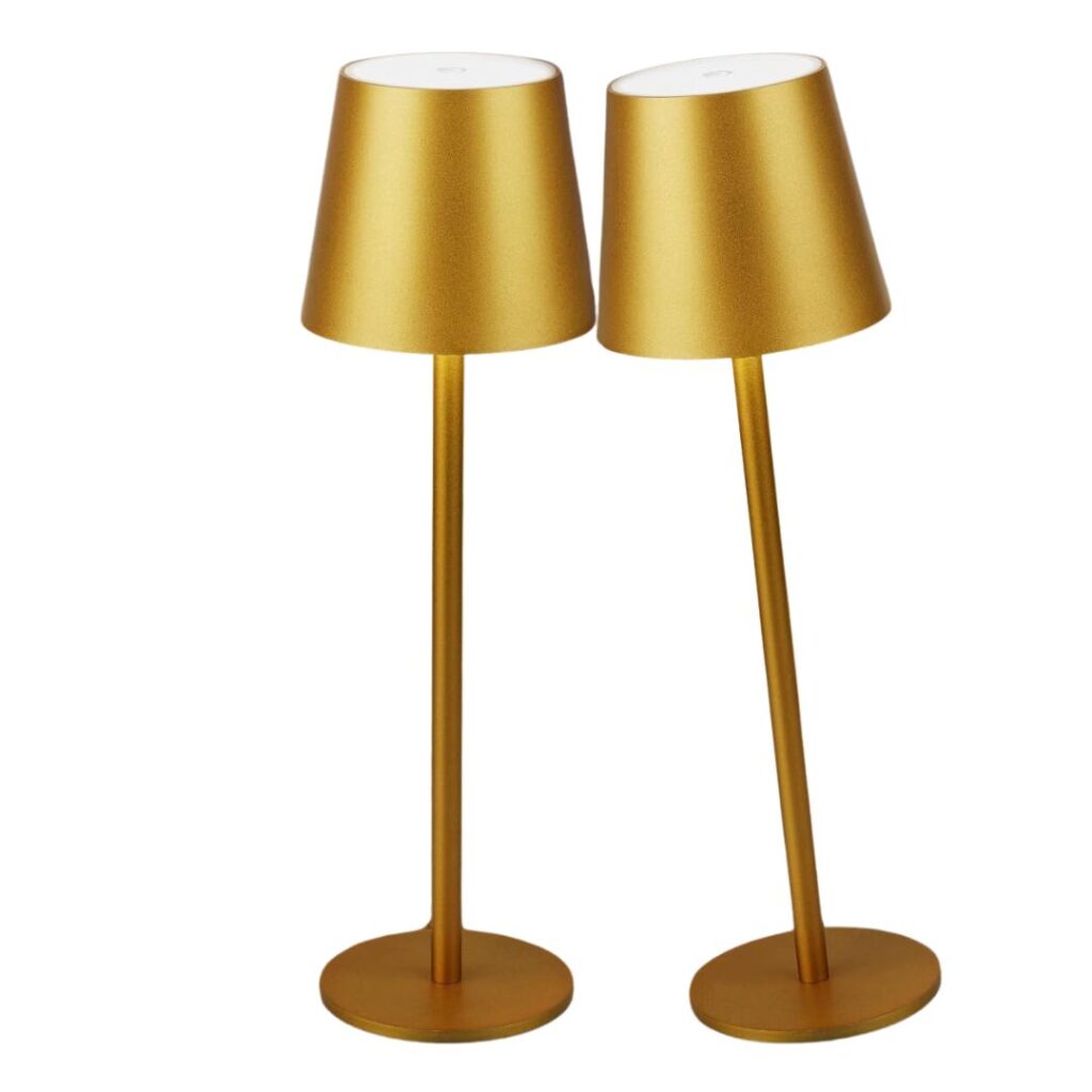 Two tall, gold-colored table lamps with conical shades stand side by side. Their sleek, modern designs with a metallic finish and round bases add an elegant touch to any room. Perfect for incorporating into your fall kitchen decor ideas on a budget.