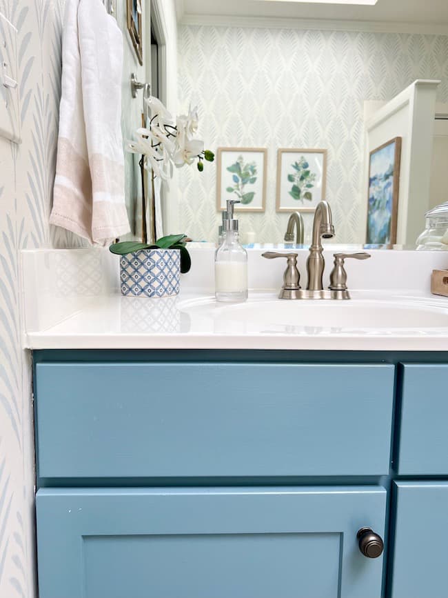Bathroom vanity painted blue with Sherwin-Williams Blustery Sky